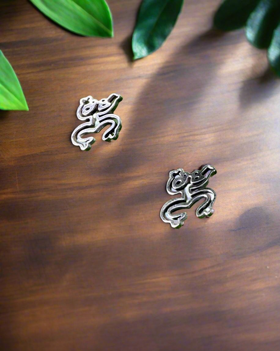 Coquí Taíno earrings in polished stainless steel, honoring Puerto Rican and indigenous culture