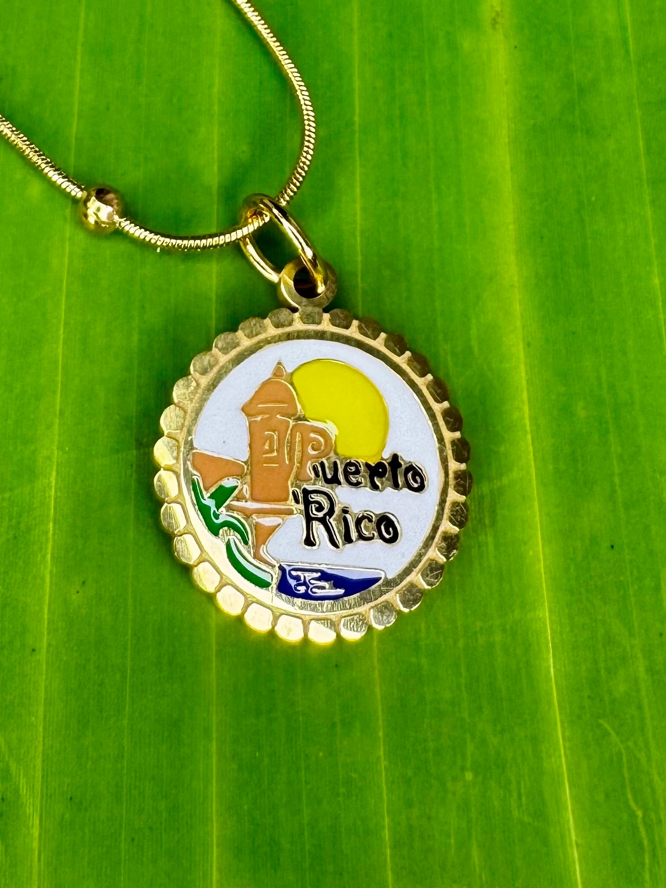 Gold stainless steel necklace with colorful El Morro charm representing Puerto Rico’s iconic fortress