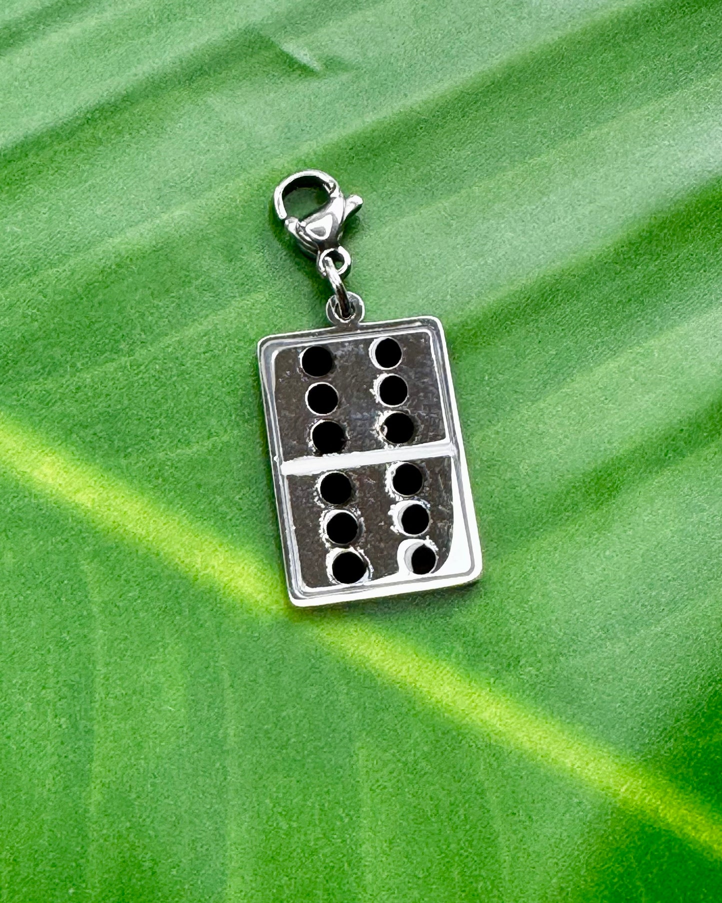 Puerto Rico Dominoes charm in gold and silver stainless steel, cultural jewelry representing the island’s popular game.