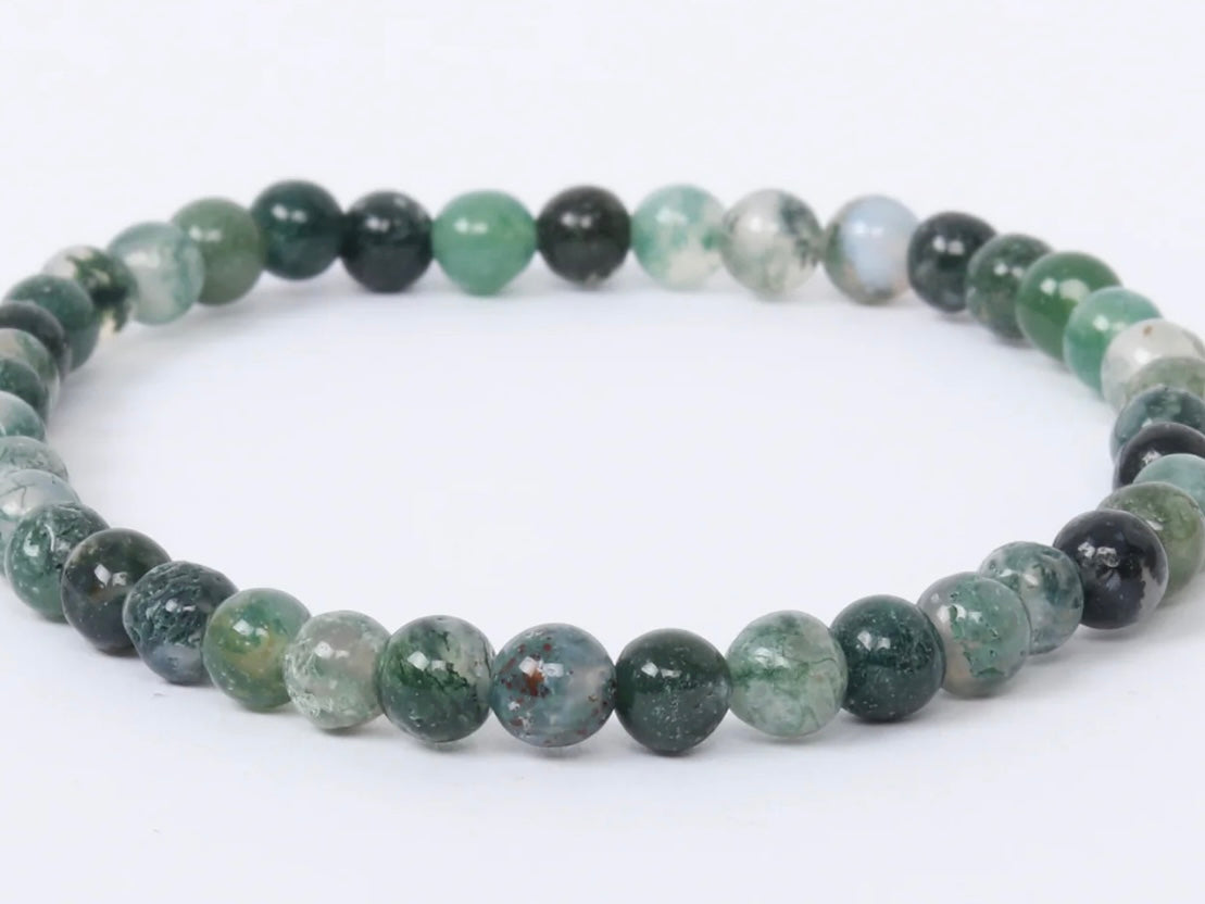 4mm Moss Agate bracelet with natural green gemstone beads, known for grounding and heart-healing energy.