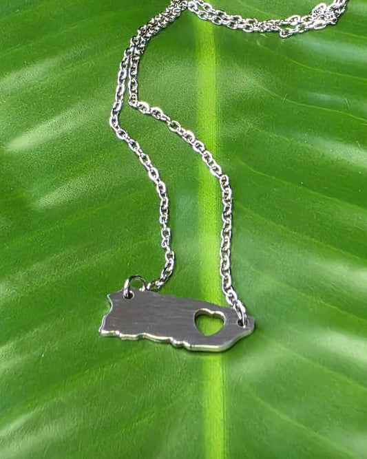 Stainless steel Puerto Rico map necklace with small heart detail, available in silver and gold, 17-inch chain.