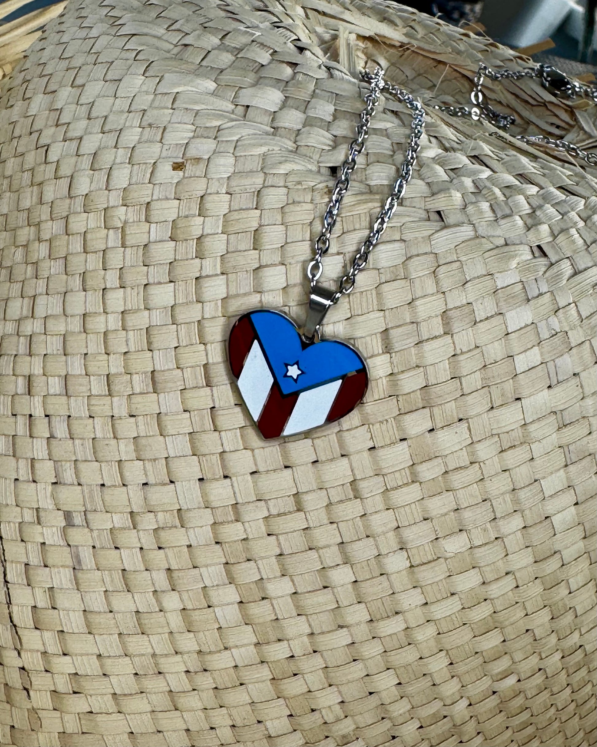 17½-inch stainless steel necklace with heart-shaped charm displaying the Puerto Rico flag, symbolizing love and pride for the island.