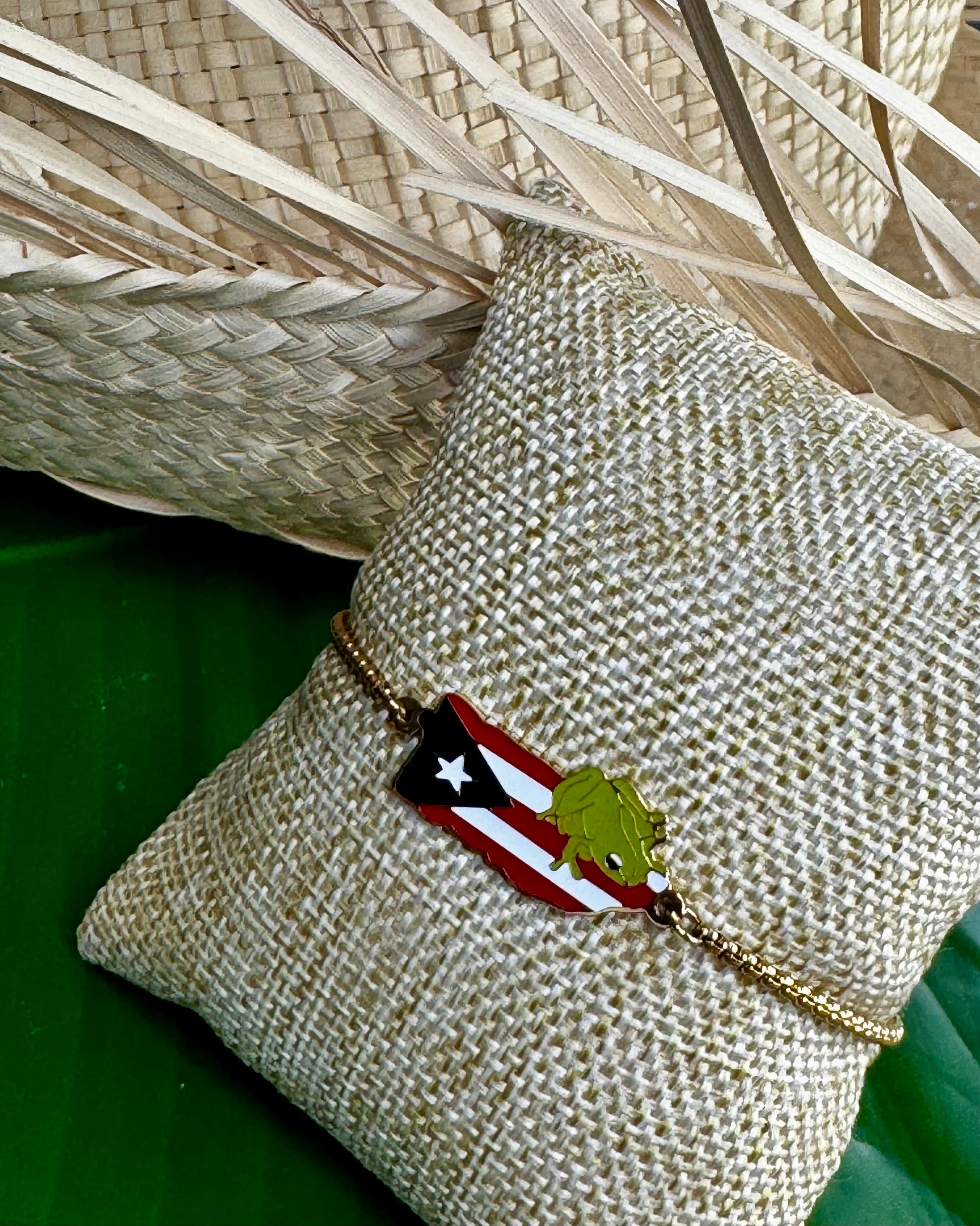 Gold stainless steel bracelet with Puerto Rico flag charm accented by a small Coquí in the corner, representing Puerto Rican pride