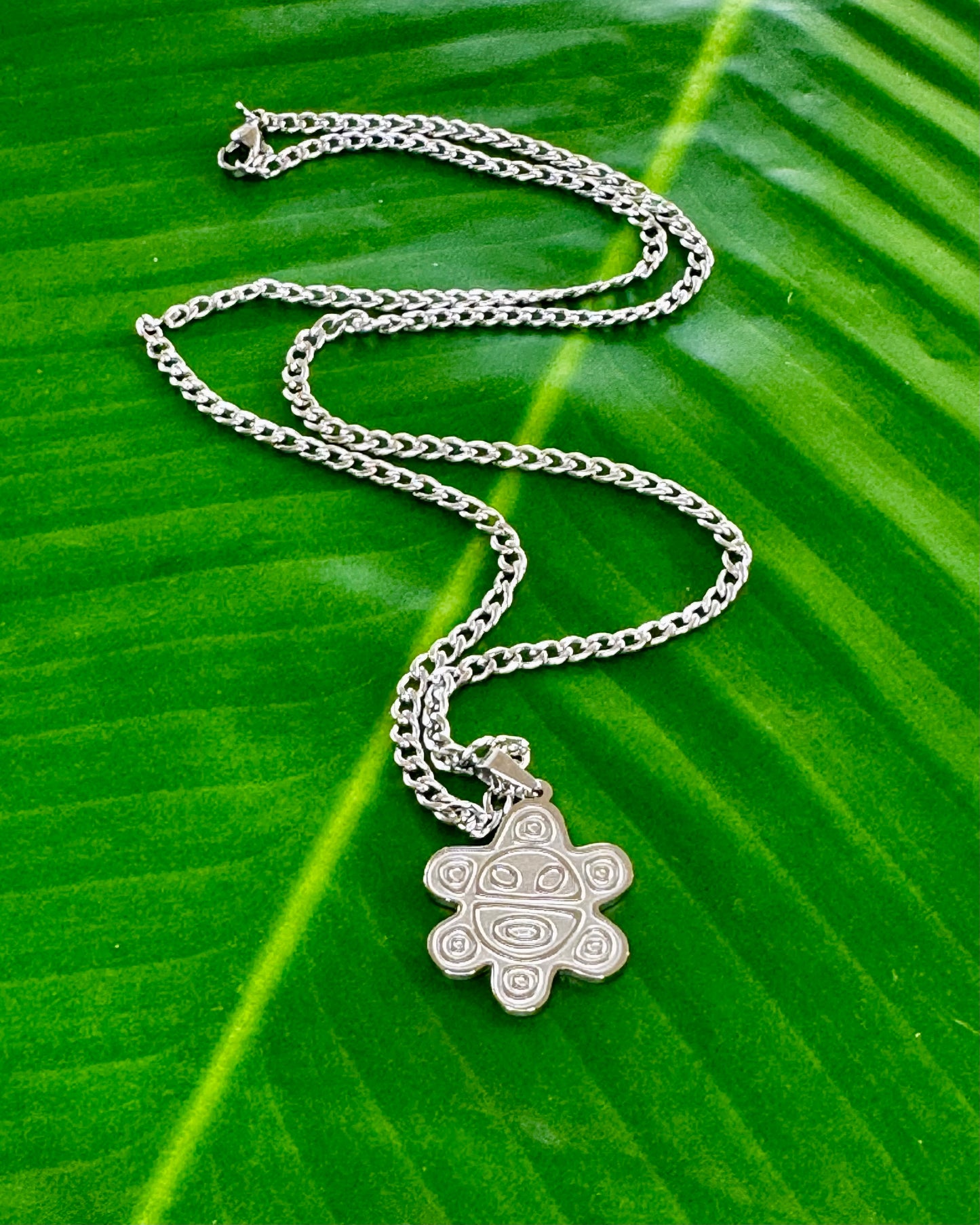 20-inch stainless steel necklace with a Sol Taíno charm in gold or silver, symbolizing Puerto Rican Taíno culture and heritage
