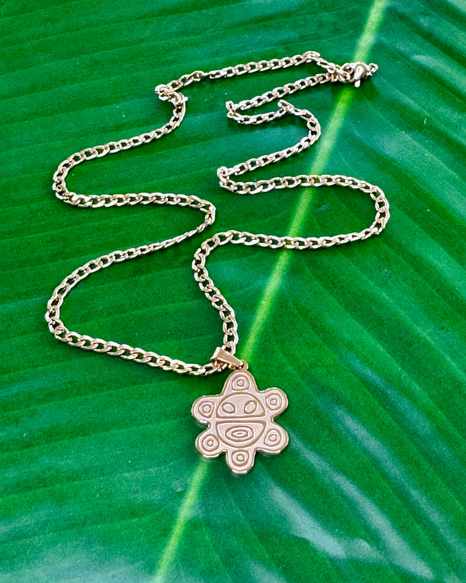 20-inch stainless steel necklace with a Sol Taíno charm in gold or silver, symbolizing Puerto Rican Taíno culture and heritage