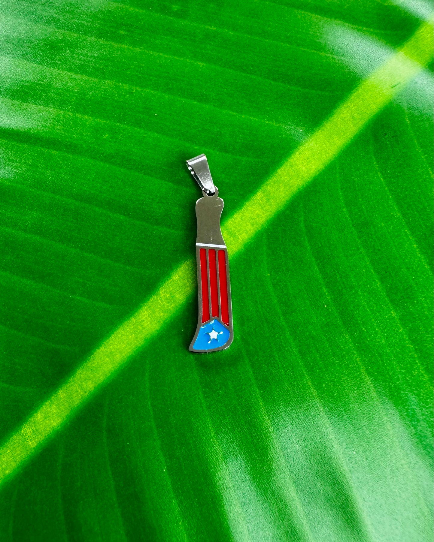 Stainless Steel machete charm, Boricua jewelry accessory, water- resistant and durable.