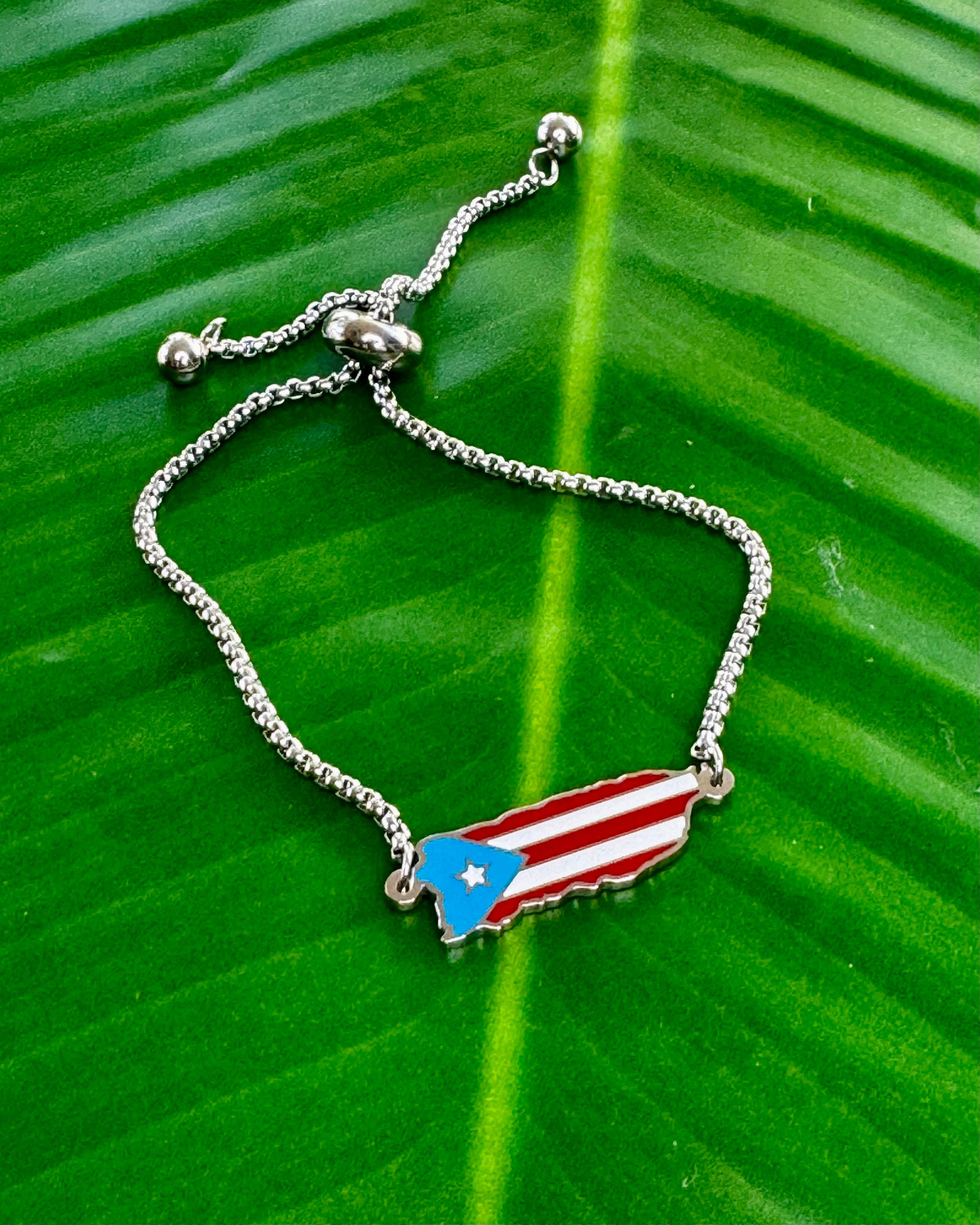 Adjustable stainless steel bracelet in silver or gold with Puerto Rico island charm decorated in Puerto Rican flag colors