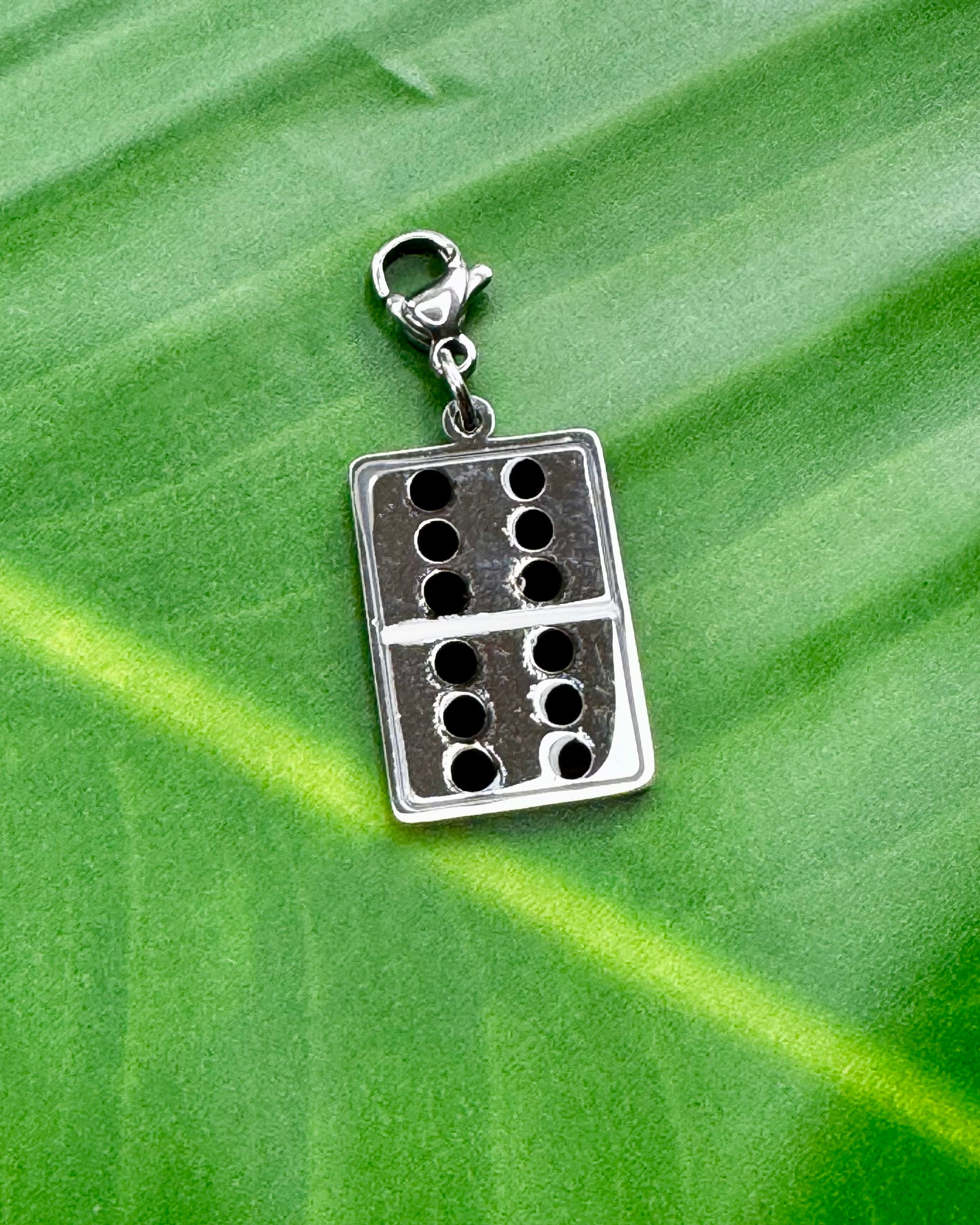 Puerto Rico Dominoes charm in gold and silver stainless steel, cultural jewelry representing the island’s popular game.