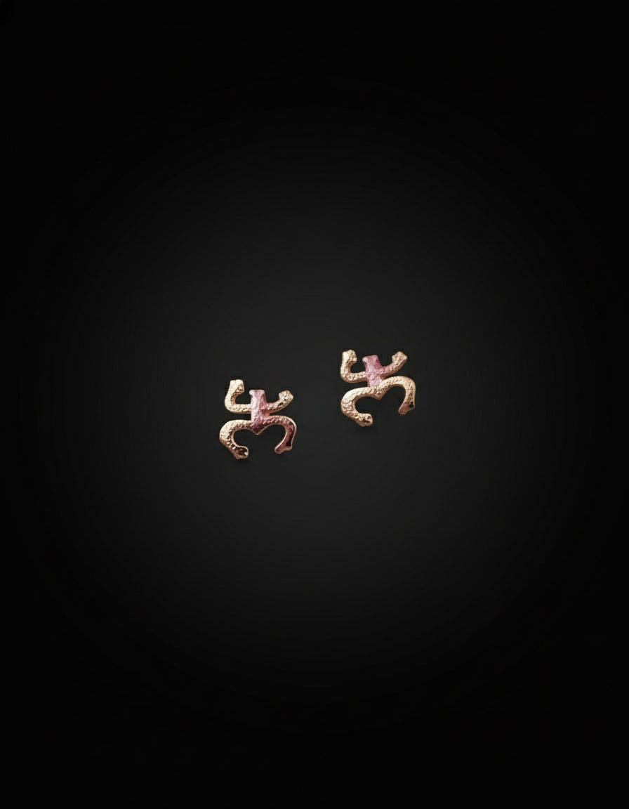 Small stainless steel stud earrings featuring the Coquí Taíno symbol