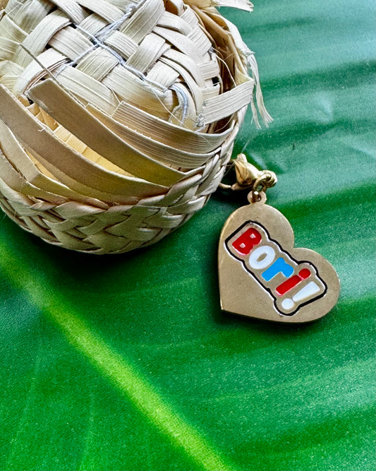 Puerto Rican Bori charm in gold stainless steel, Boricua heritage jewelry.