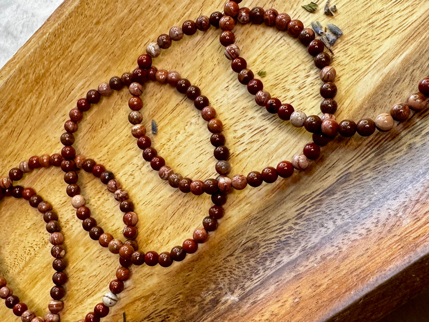 4mm Brecciated Jasper crystal bracelet with rich red and brown patterns, a stone for protection and motivation.