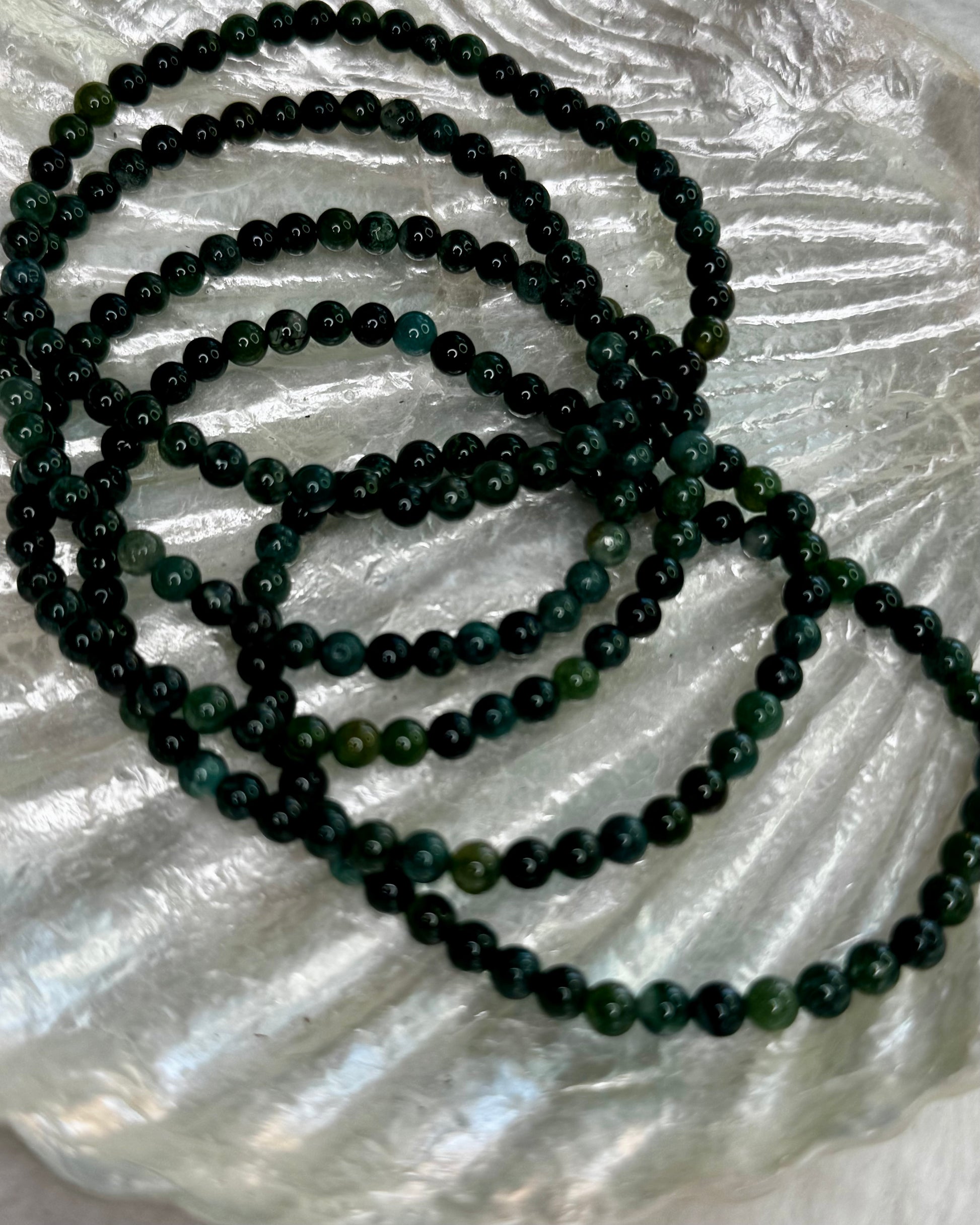 4mm Moss Agate bracelet with natural green gemstone beads, known for grounding and heart-healing energy.