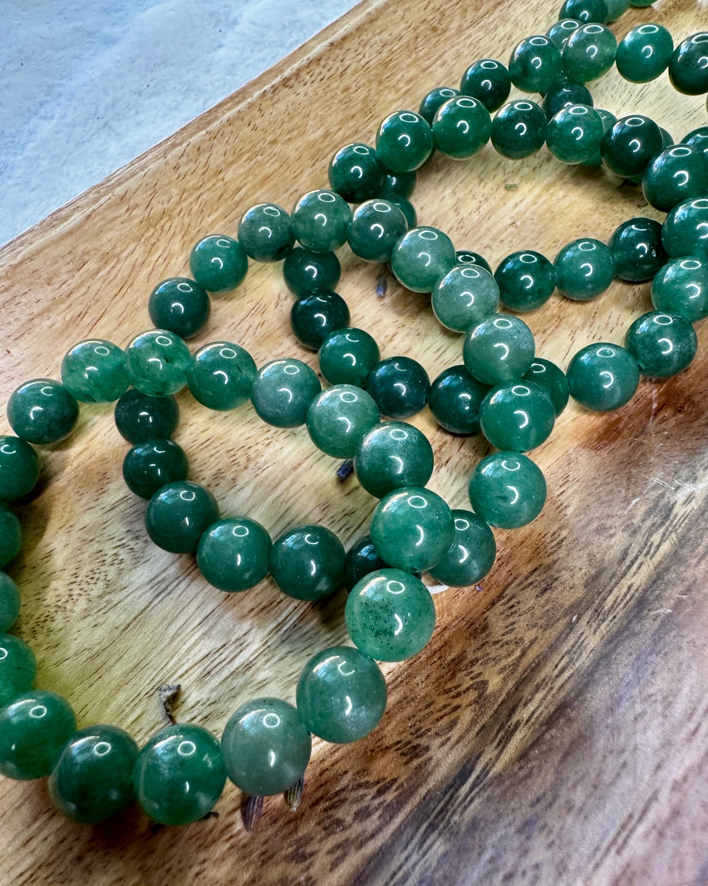 Natural Moss Agate beaded bracelet with 10mm stones for emotional healing and inner harmony.