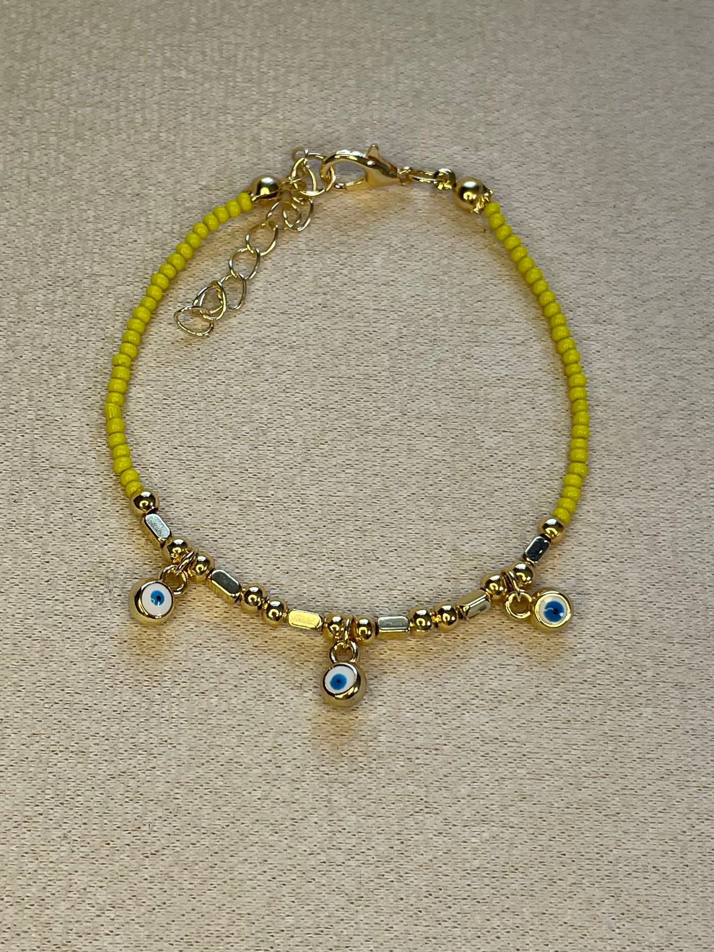 Three Evil Eye Gold Plated Yellow Bracelet