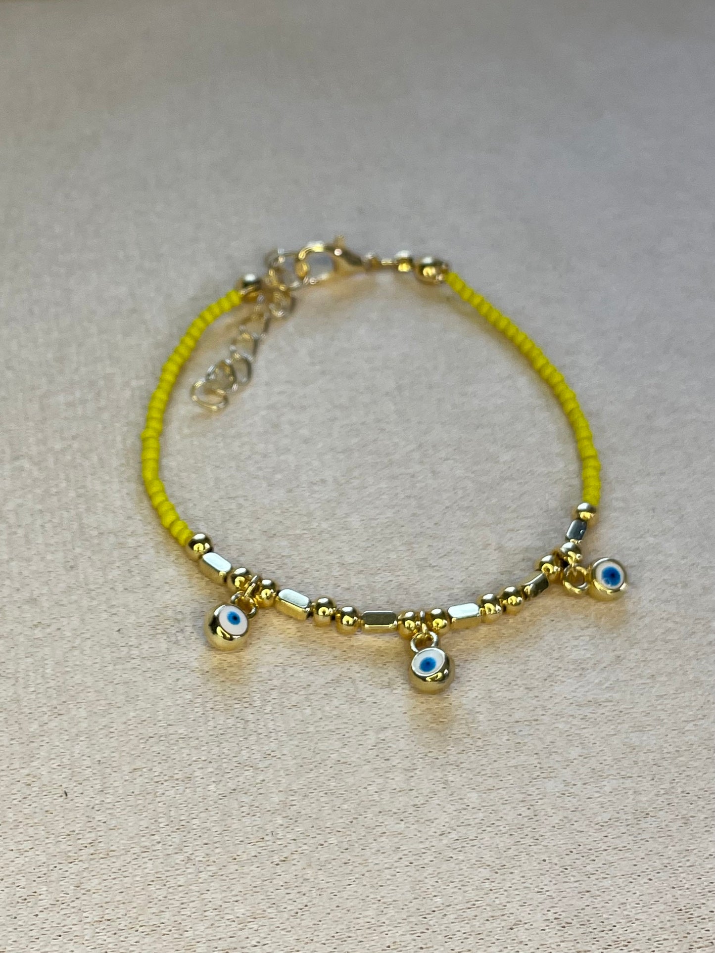 Three Evil Eye Gold Plated Yellow Bracelet